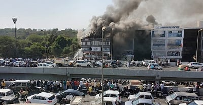 Surat: Fire fighting operations underway after a massive fire broke out at a coaching centre atop a four-storey building, in Sarthana area of Gujarat