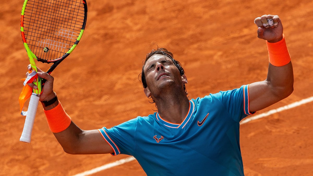 Rafael Nadal celebrates after winning Felix Auger-Aliassime, from Canada, during the Madrid Open.