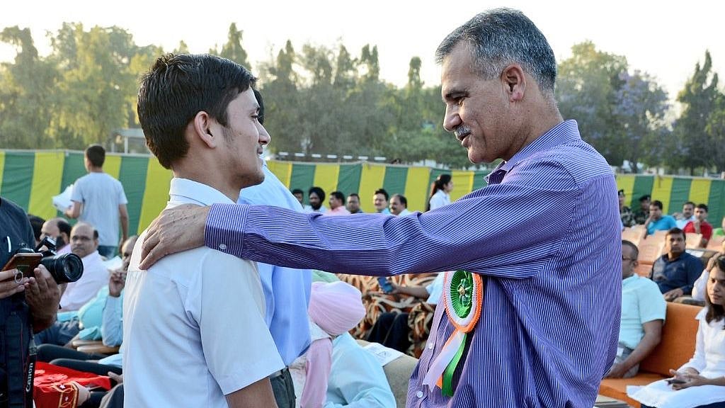 Vivek scored 489 out of 500 (97.80 percent).