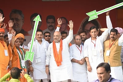 Siwan: BJP chief Amit Shah and Bihar party President Nityanand Rai wave at supporters during a public rally in Bihar