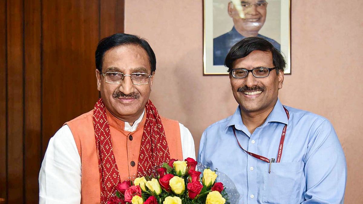 HRD Miniter Ramesh Pokhriyal Nishank being greeted by the Department of Higher Education Secretary R Subrahmanyam.