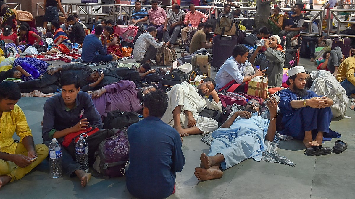 Stranded passengers at a railway station after train services were disrupted due to Cyclone Fani in Kolkata.