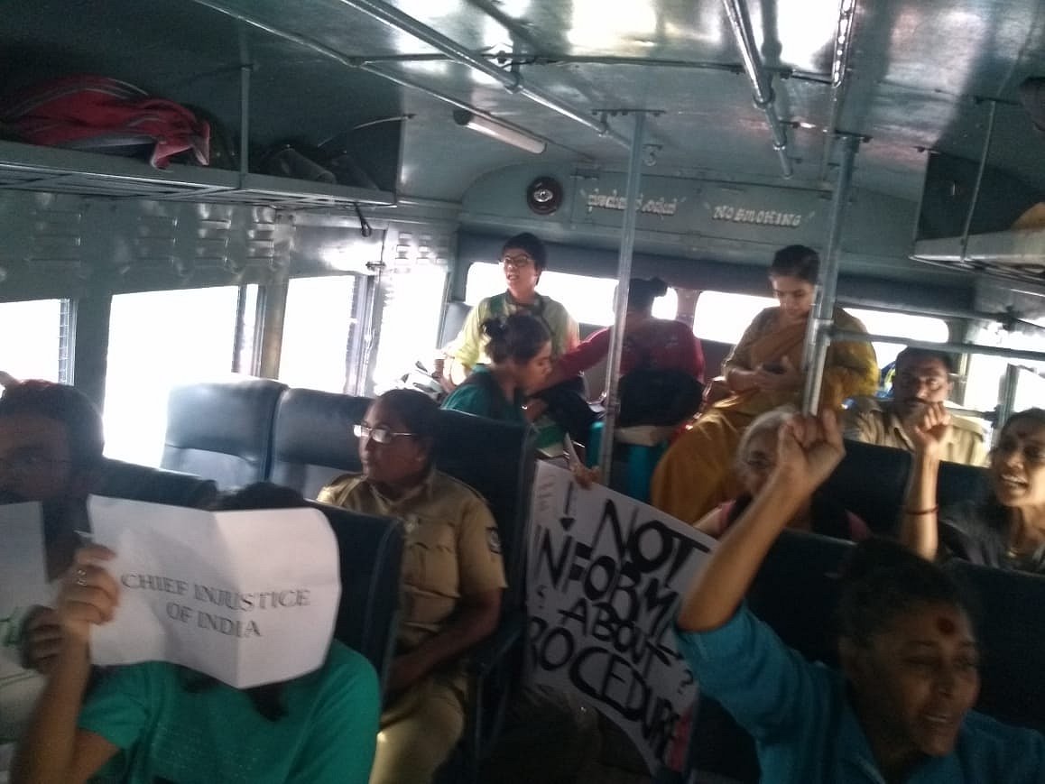 Activists being transported to Halasuru Gate station in a police van on Thursday, 9 May.