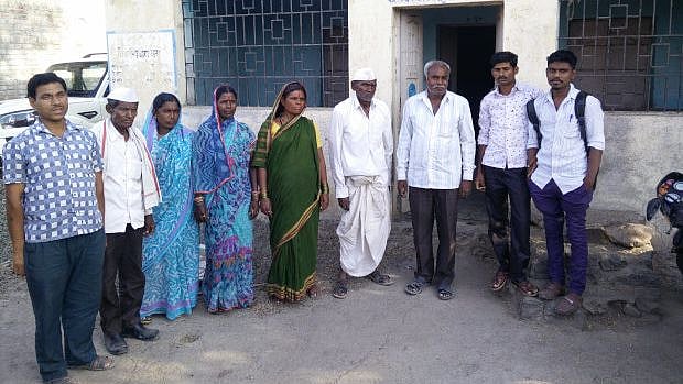 Dalit families gather near a community centre in Gharegaon in Maharashtra’s Osmanabad district. 