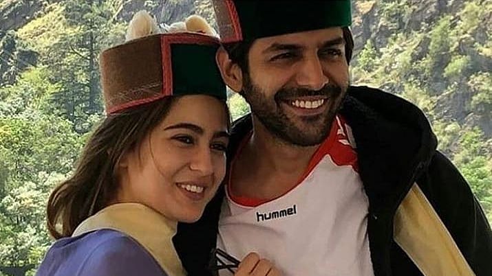 Kartik Aaryan and Sara Ali Khan in Himachali caps