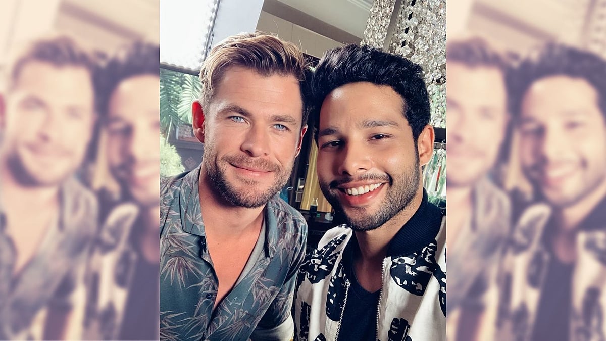 Chris Hemsworth and Siddhant Chaturvedi at a promotional event for <i>Men in Black: International.</i>