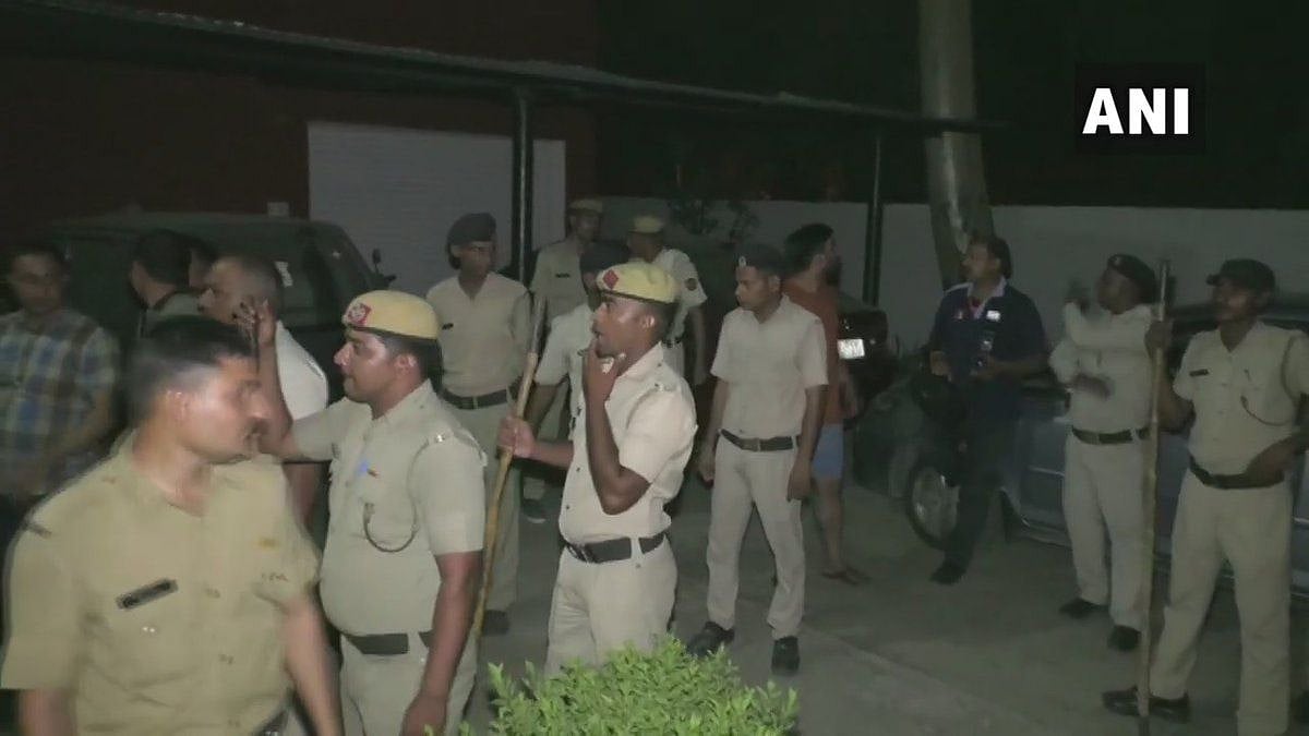 Police gather outside the hospital in Haryana after the incident. 