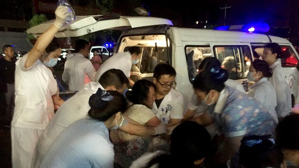 Medical staff tend to a wounded person at a local hospital in Changning County of Yibin City, southwest China’s Sichuan Province, on 18 June. &nbsp;