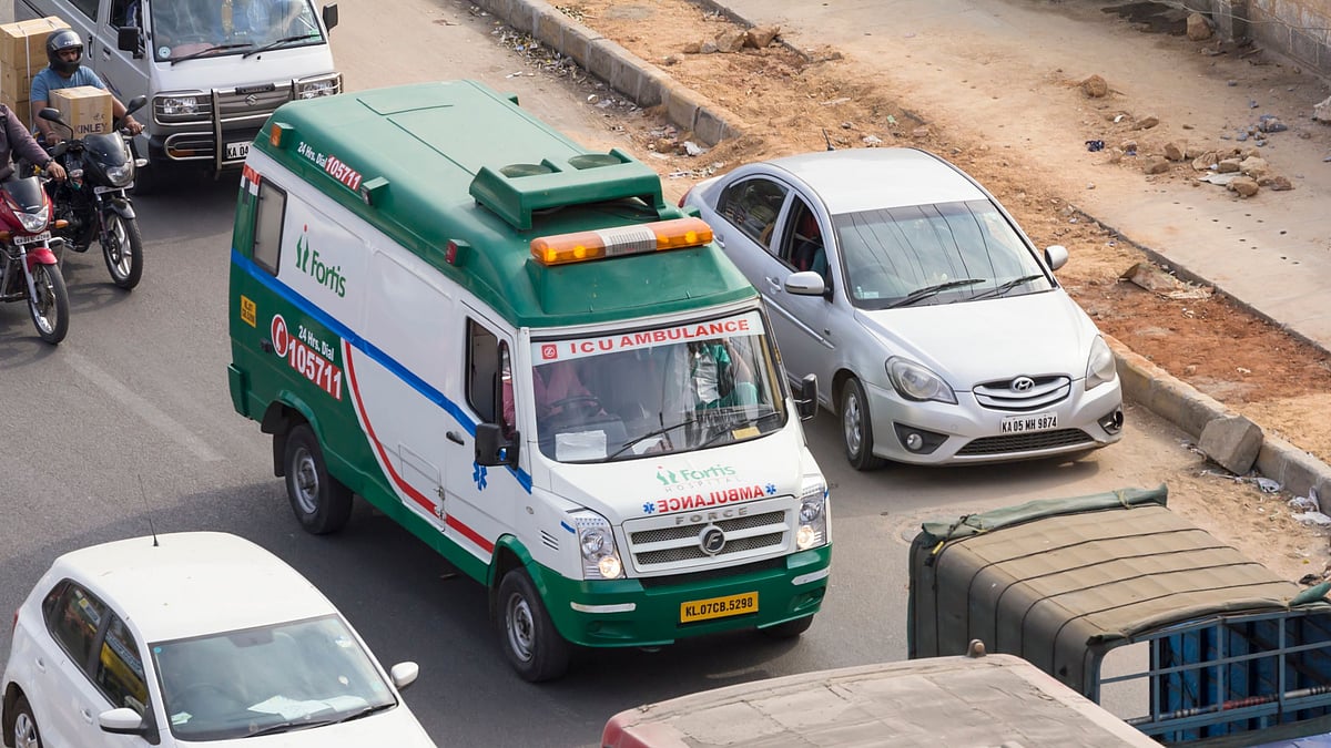 Bangalore, India: An ambulance belonging to a private hospital tries to make its way through traffic in south Bangalore, India. 