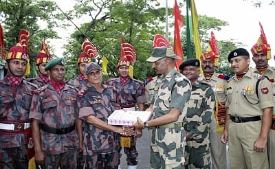 Tripura: Soldiers of Border Security Force (BSF) and Border Guards Bangladesh (BGB) exchange greetings and sweets on the eve of Eid-Ul-Fitr at Akhuara land port and immigration centre, in the Agartala-Brahminbaria border of Tripura on June 4, 2019. (Photo: IANS)