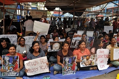 Kolkata: Juniors doctors of NRS Medical College and Hospital stage a demonstration as they continued their strike protesting an attack on a colleague at the hospital, in Kolkata on June 12, 2019. (Photo: IANS)