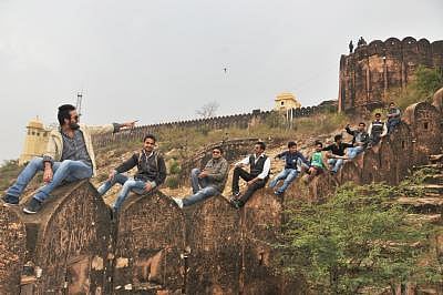 Jaipur, Rajasthan, India, Tuesday, 5 Jan, 2013, Youths enjoying moments of life between pleasant weather on Nahargarh Fort. But it could be fatal for their life. ImagesMart.co/Raghuveer