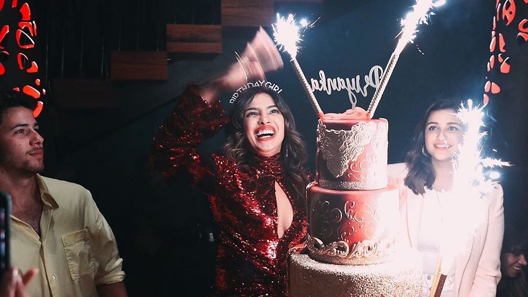 Priyanka Chopra cuts the cake.&nbsp;