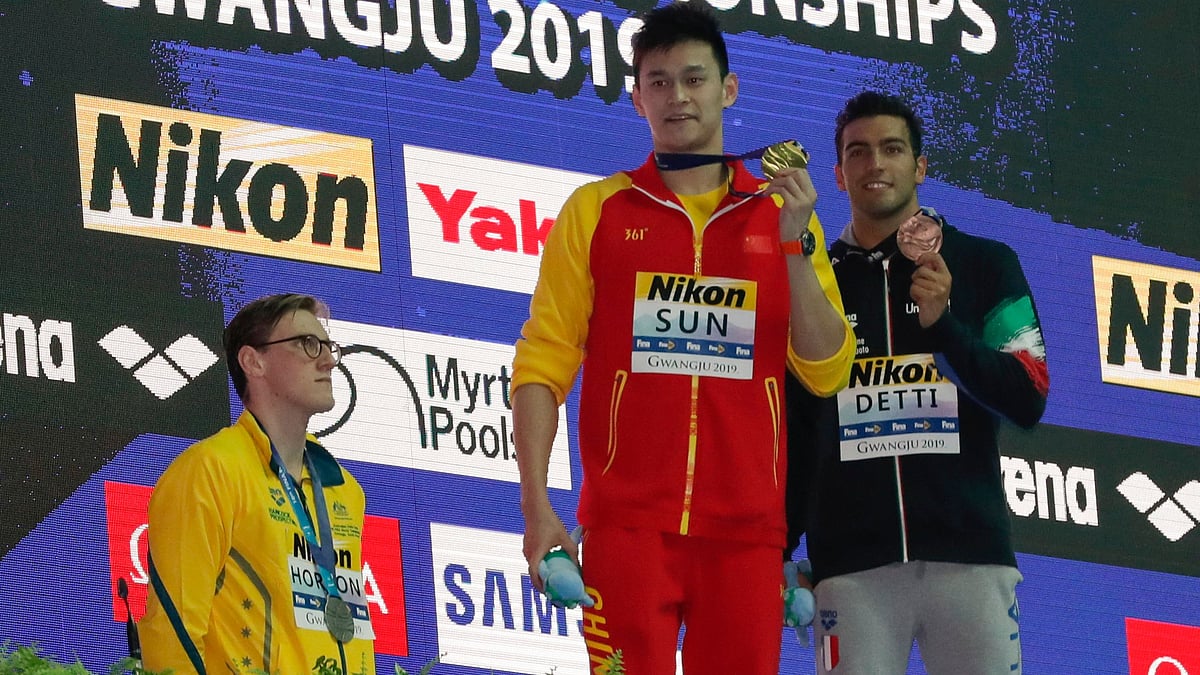 Mack Horton (left), who took silver behind Sun, refused to step onto the podium for photos after the medal ceremony.