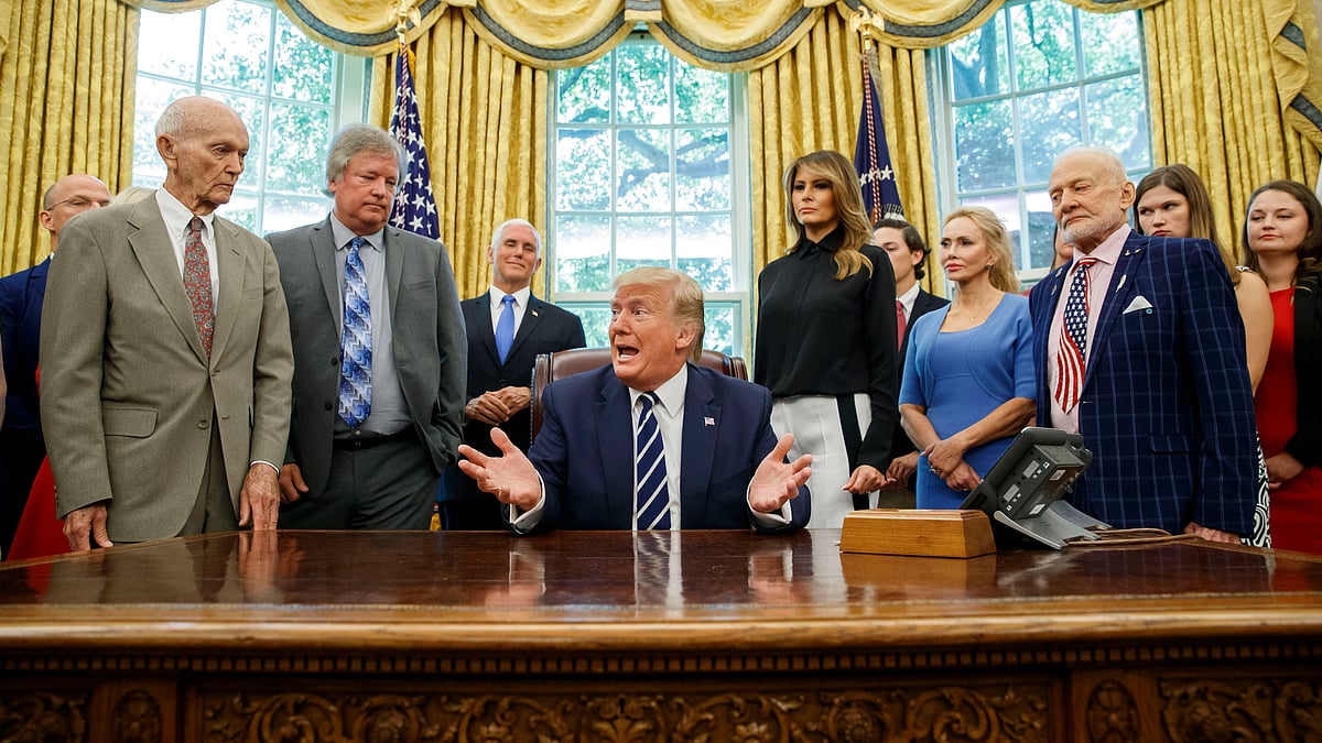 Donald Trump with Apollo 11 astronauts, Michael Collins (L) and ‘Buzz’ Aldrin (R) and Eric Armstrong, son of Neil Armstrong, second from left. 