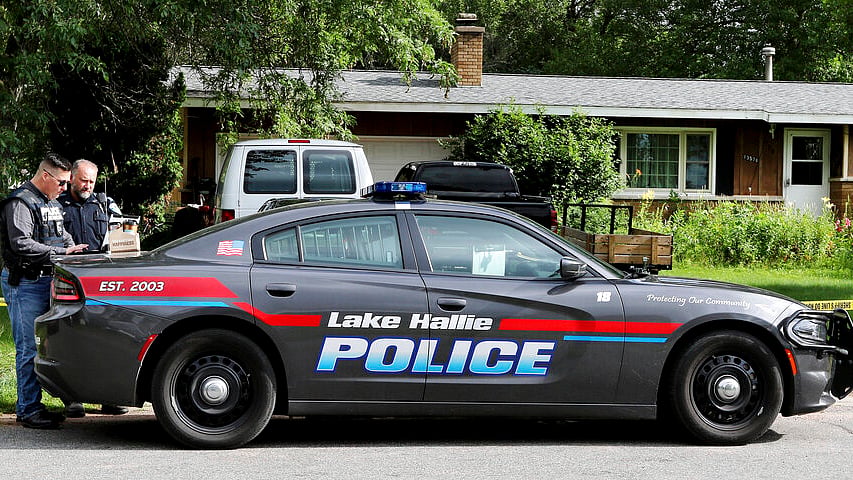 Lake Hallie Police work outside a home on 29 July 2019, in Lake Hallie, following a shooting the night before. 