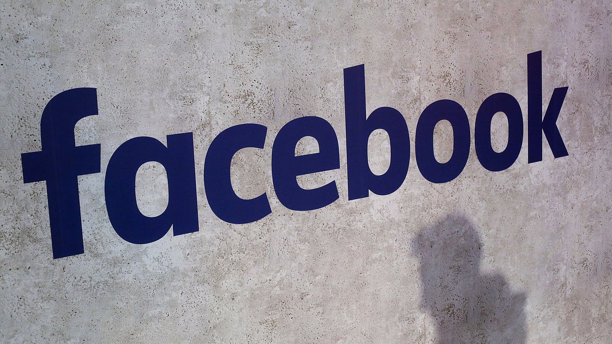 Facebook logo displayed at a business gathering in Paris