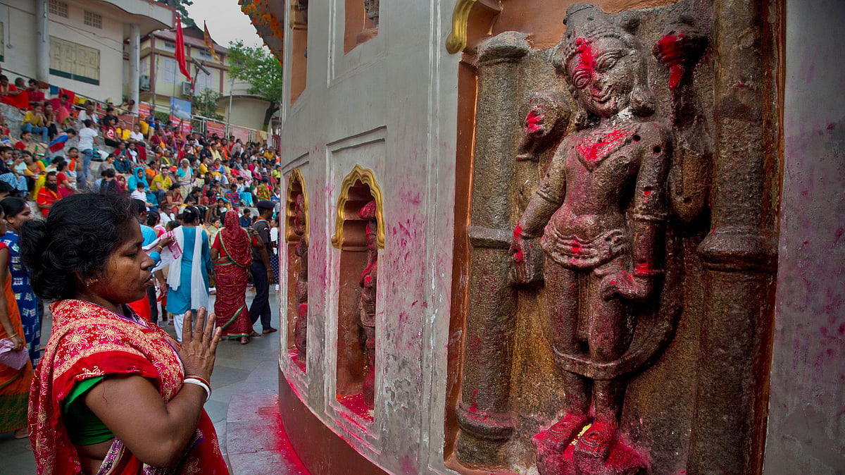 Monika Deb Nath, 45, offers prayers at the Kamakhya temple during the Ambubachi festival in Guwahati, India.