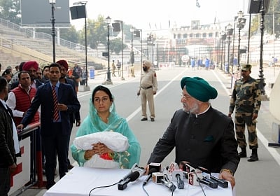 Attari: Union Ministers Harsimrat Kaur Badal and Hardeep Singh Puri address a press conference ahead of leaving for Pakistan