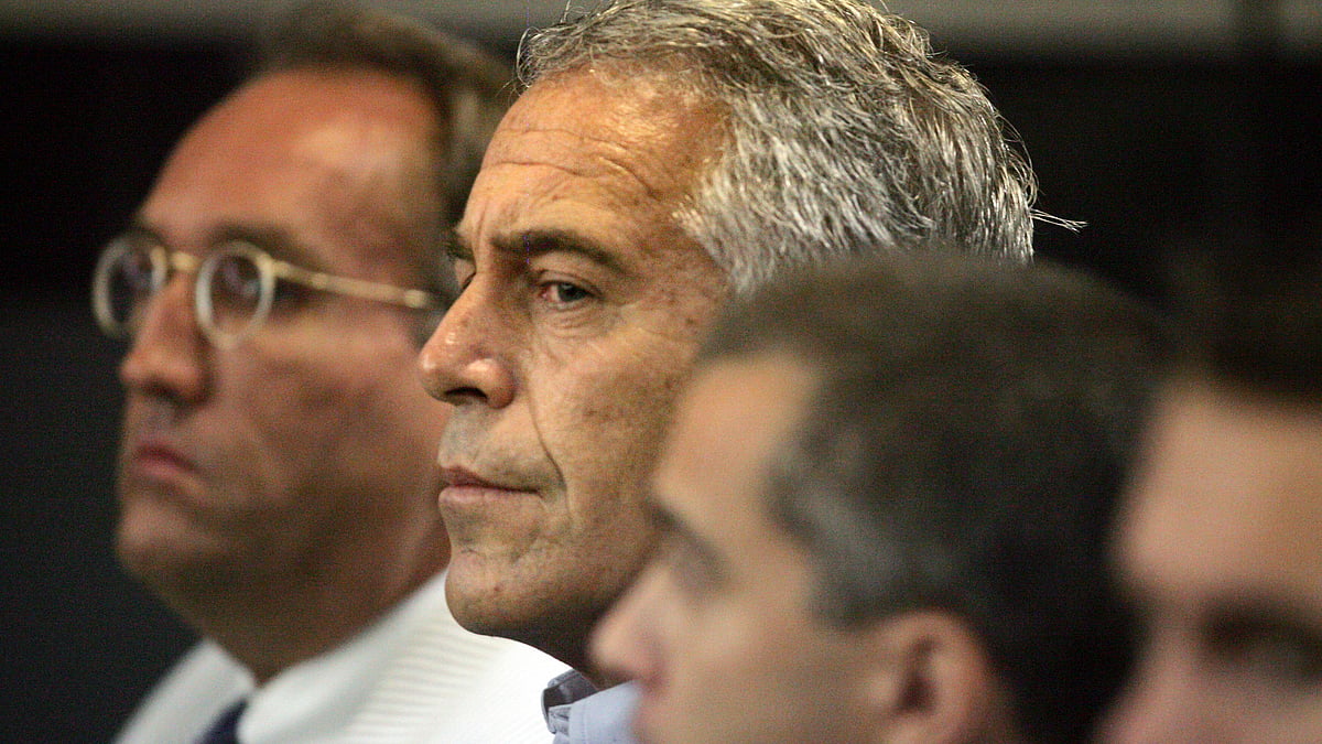 File photo of Jeffrey Epstein (centre).