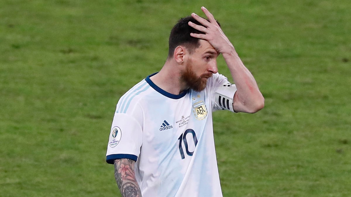 Argentina’s Lionel Messi holds his head as he leaves the field after a Copa America semifinal soccer match against Brazil at the Mineirao stadium in Belo Horizonte, Brazil, Tuesday, July 2, 2019. 