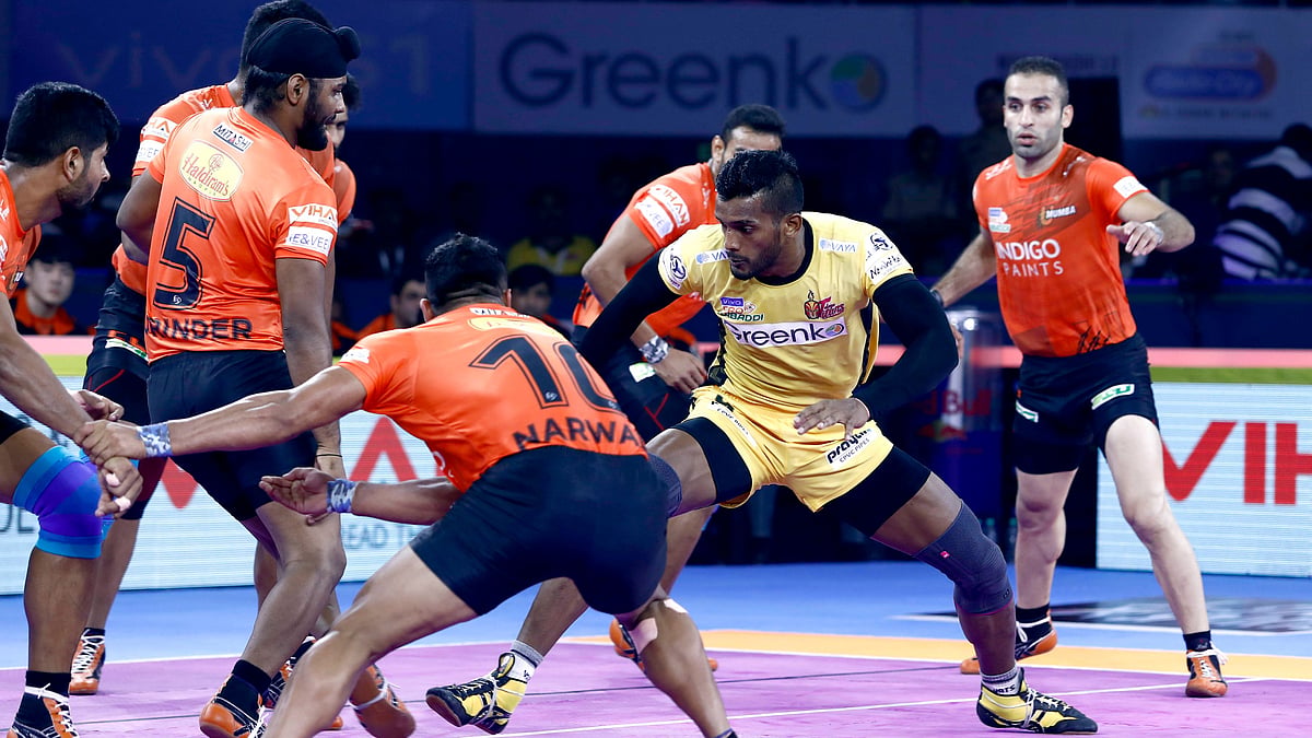 Telugu Titans’ Siddhart Desai during a raid in the opposition half.