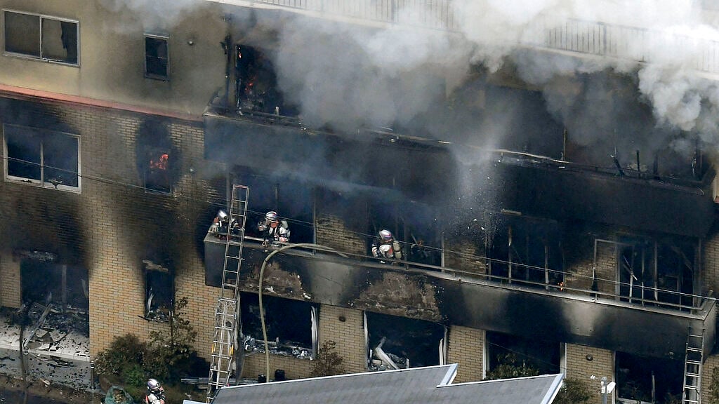 Smoke billows from a Kyoto Animation buildin in Kyoto, western Japan, Thursday, 18 July, 2019.