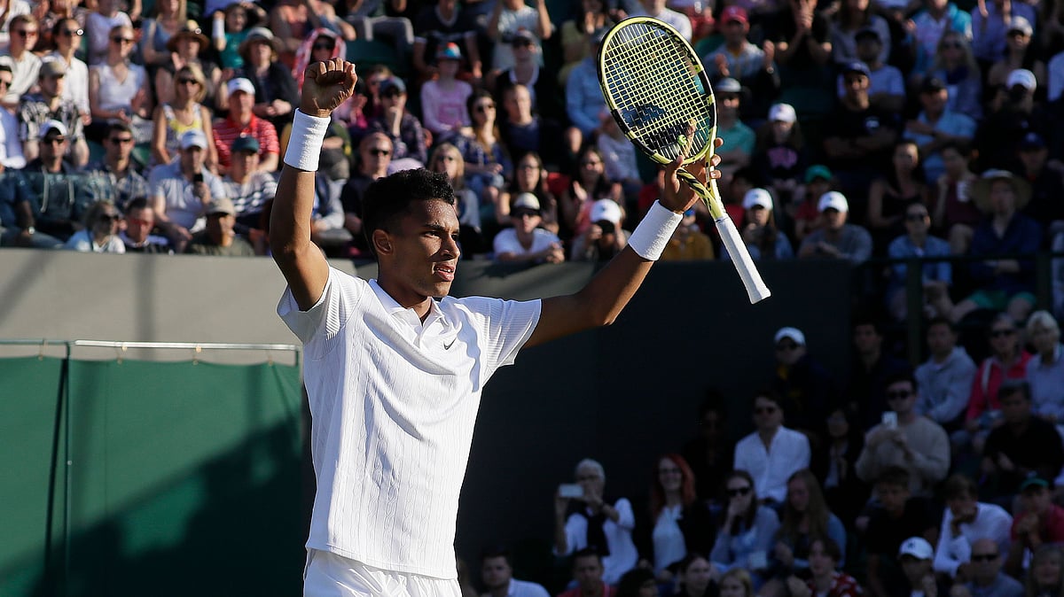 Canada’s Felix Auger-Aliassime celebrates after beating Corentin Moutet of France in a Men’s singles match during day three of the Wimbledon Tennis Championships in London.