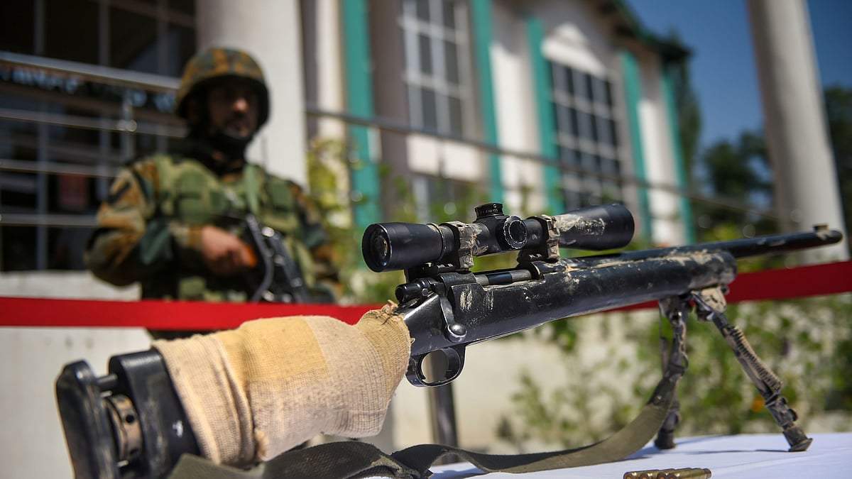 An American made telescopic gun recovered during an anti-militant operation on display during a press conference, in Srinagar.