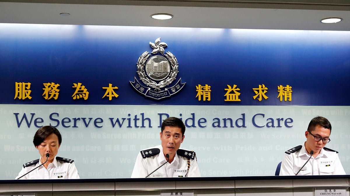 Police Senior Superintendent (Operations) Hong Kong Island Ng Lok-chun, center, speaks during a press conference in Hong Kong. 