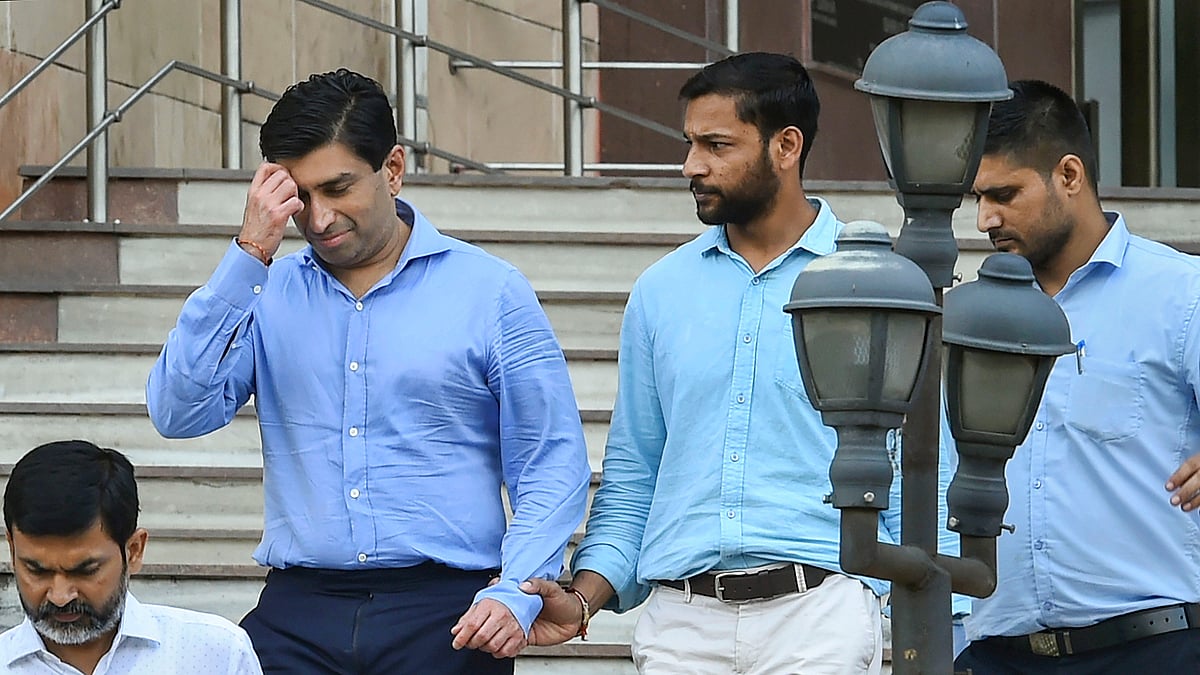 Ratul Puri (L) leaves the ED office after being arrested in connection with a Rs 354 crore bank loan fraud case, in New Delhi, on 20 Aug 2019. 