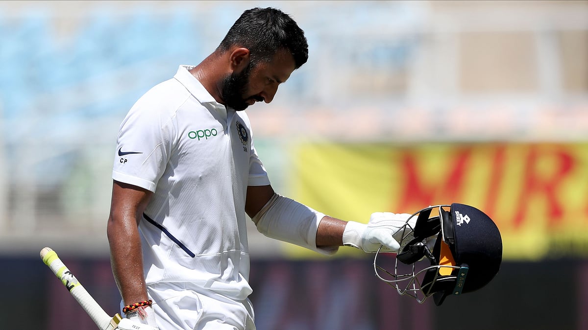 West Indies debutant Rahkeem Cornwall got his maiden Test wicket as Cheteshwar Pujara was caught at backward point for 6.