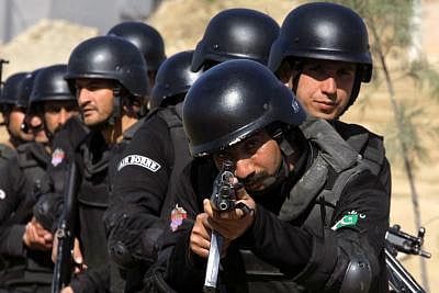 NOWSHERA, Feb. 11, 2015 (Xinhua) -- Pakistani police commandos demonstrate their skills during a special elite police training course at a police training centre in northwest Pakistan