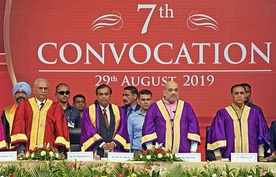 Ahmedabad: Union Home Minister Amit Shah with Gujarat Chief Minister Vijay Rupani, Reliance Industries Chairman Mukesh Ambani and Pandit Deendayal Petroleum University (PDPU) Standing Council Chairman D. Rajagopalan at the 7th Convocation ceremony of PDPU, in Ahmedabad on Aug 29, 2019. (Photo: IANS)