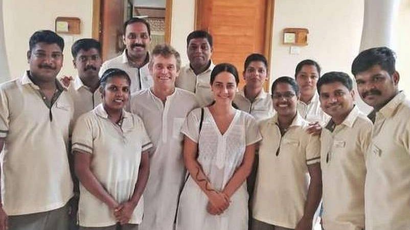 Actor Willem Dafoe poses with fans in Kochi.