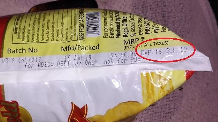 Andhra Pradesh government has been accused of supplying expired oil packets to victims of the Krishna flood.