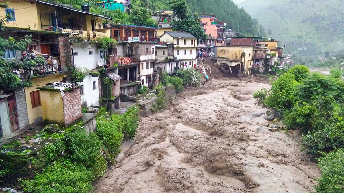 Floodwaters gush down after a cloudburst in Chamoli district on 12 Aug 2019. 