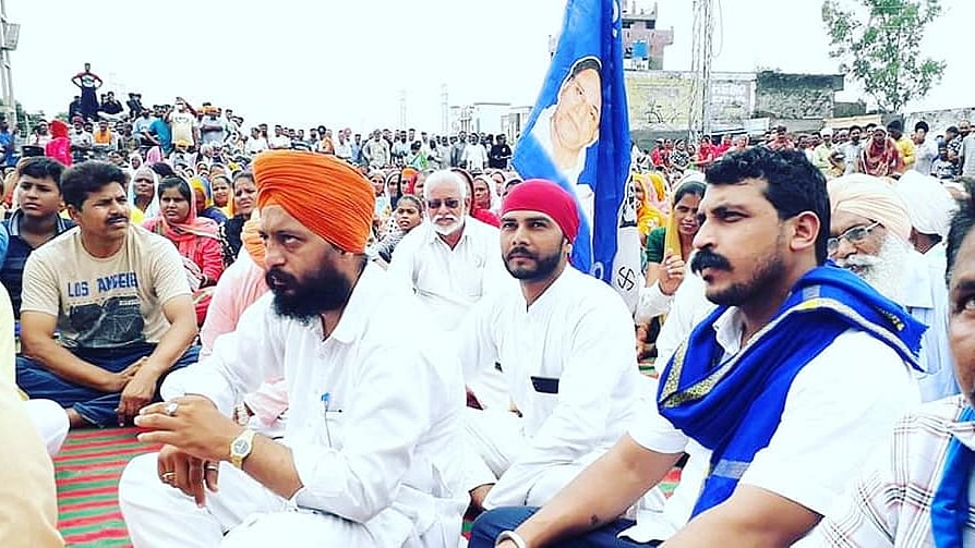 File photo of Bhim Army Chief Chandrashekhar Azad sitting in a protest against the demolition of the Ravidas temple in Delhi’s Tughlaqabad area.