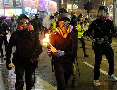 HONG KONG, Aug. 31, 2019 (Xinhua) -- A rioter is about to throw a Molotov cocktail at the police in Causeway Bay of south China