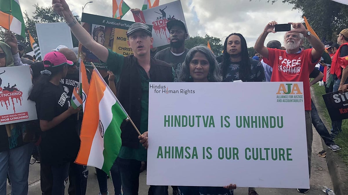 Protestors under AJA outside the ‘Howdy, Modi’ venue.