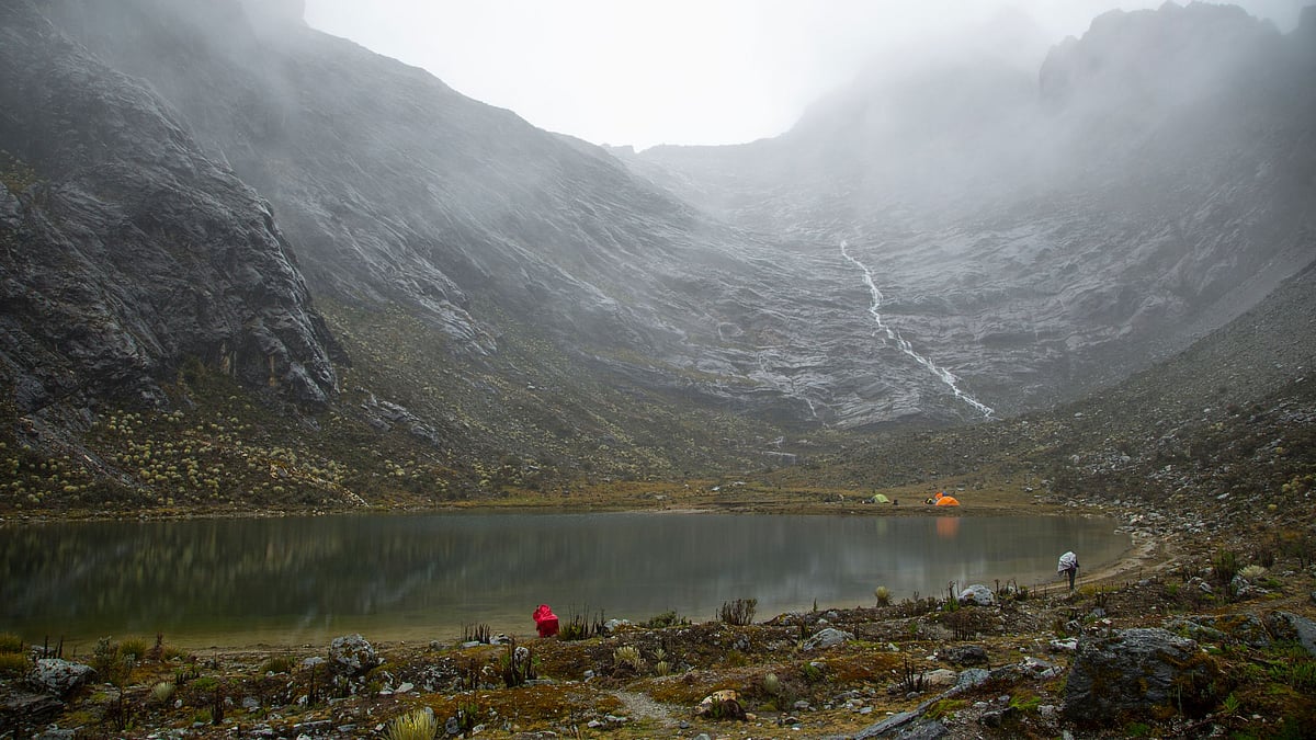Scientists gather at their camp late afternoon at the “El Suero” lagoon, during the first day of their mission to the Humboldt glacier, in Merida, Venezuela.