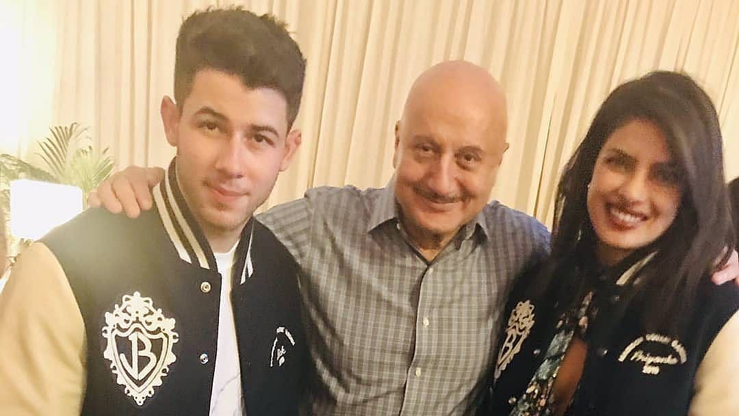 Nick Jonas, Anupam Kher and Priyanka Chopra.