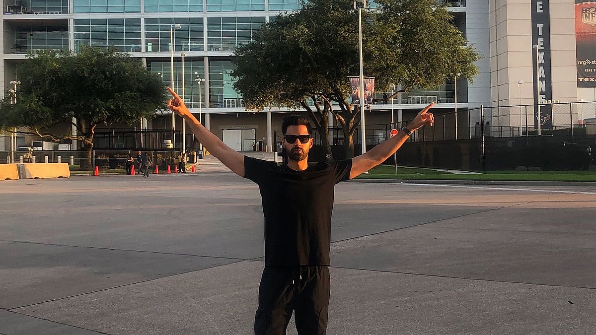 Hasan Minhaj in front of the ‘Howdy Modi’ venue.