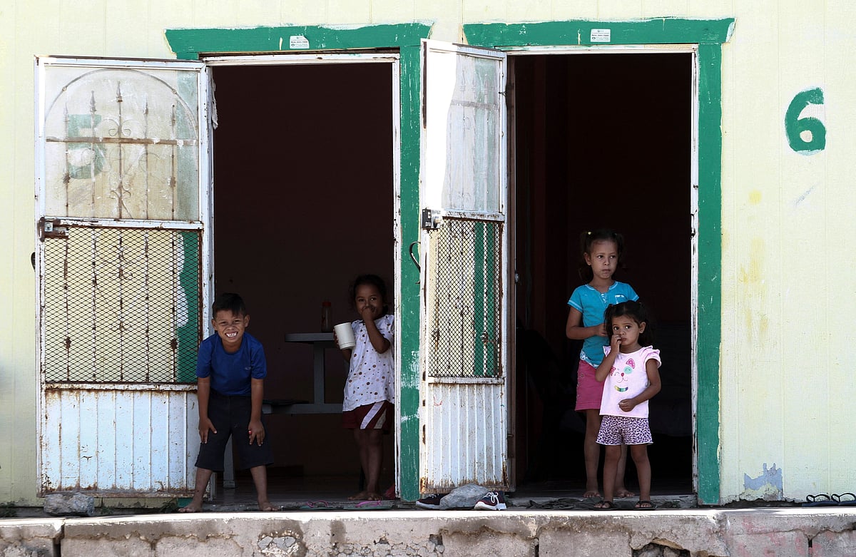 Central American migrant kids pass the time at the Pan de Vida shelter in Ciudad Juarez, Mexico on 12 September.