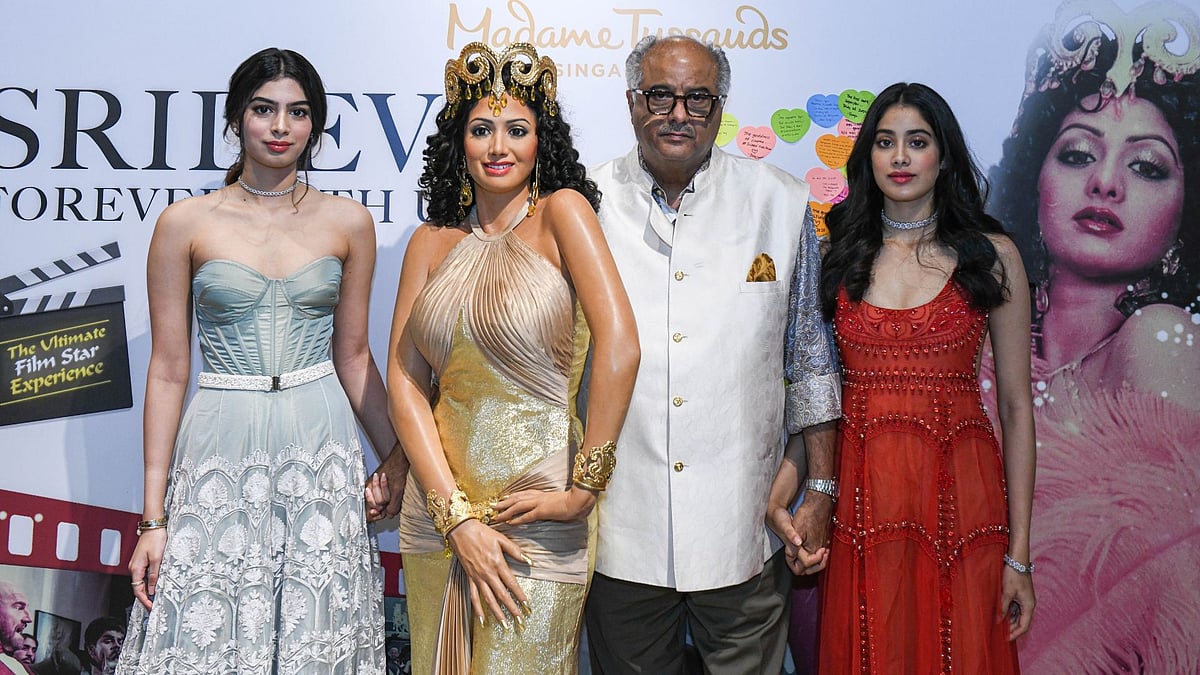 Khushi, Boney and Janhvi Kapoor pose beside Sridevi’s wax statue at Madame Tussauds Singapore.