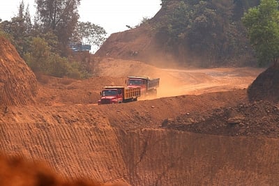 Navelim: A view of trucks moving amid mine fields near an iron plant at Navelim in Goa on March 13, 2018. BJP Goa MPs met the party