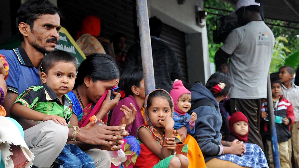 File Photo: Flood-affected people take shelter at a safe place in Sampali near Chikmagalur, Karnataka on 11 August 2019.