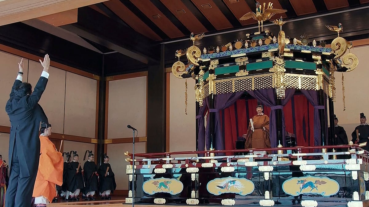 Japan’s Prime Minister Shinzo Abe bows in front of Emperor Naruhito during a ceremony to proclaim his enthronement to the world, called Sokuirei-Seiden-no-gi, at the Imperial Palace in Tokyo.