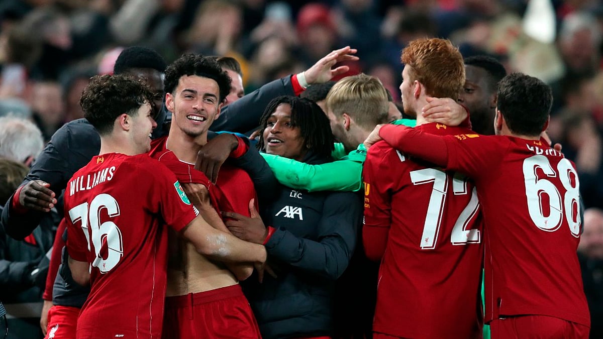 After 19 goals on a wild night at Anfield, Liverpool ousted Arsenal in the League Cup to reach the quarterfinals.
