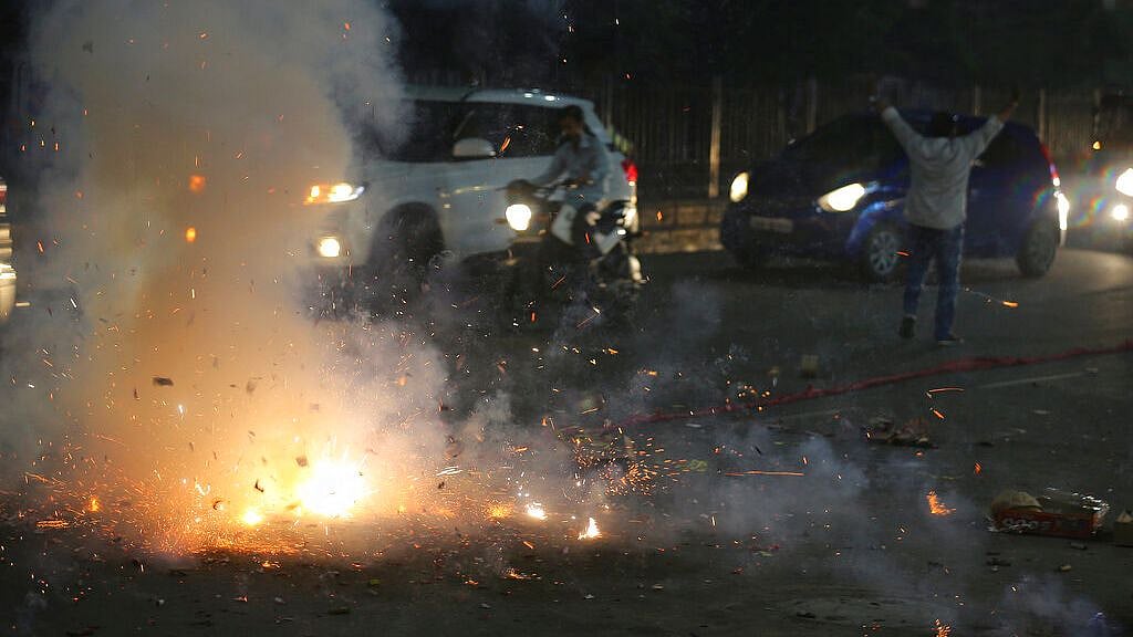 People bursting crackers to celebrate Diwali.